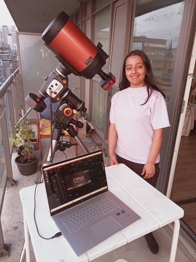 Arushi Nath with telescope on her Toronto balcony